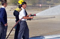 Los bomberos forestales con la Escolanía